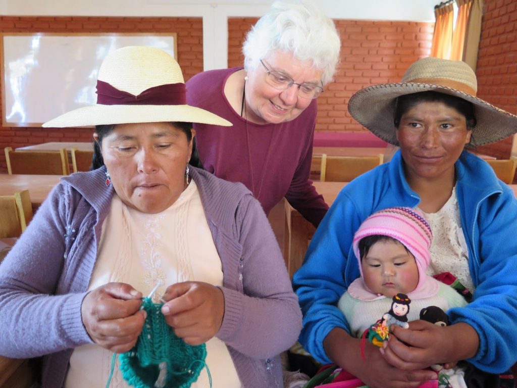 Sister Gloria Miller visits the Kantuta Knitting Group in Puno, Peru, where women create beautiful knitted goods to be marketed as far away as California. Their finger puppets are especially popular!  Credit: Sister Deborah Watson