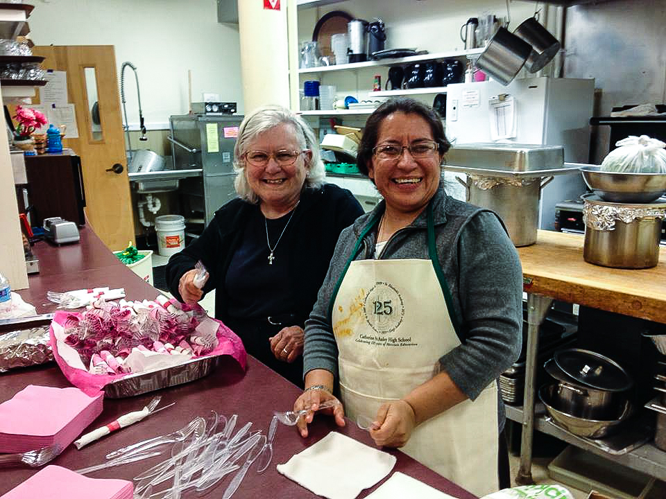 Sister Patricia Pora and Sister Elsa Roldan, RSR, of Guatemala, are all smiles as they set up for a celebratory event in the Hispanic community. Photo courtesy of Sister Patricia Pora.