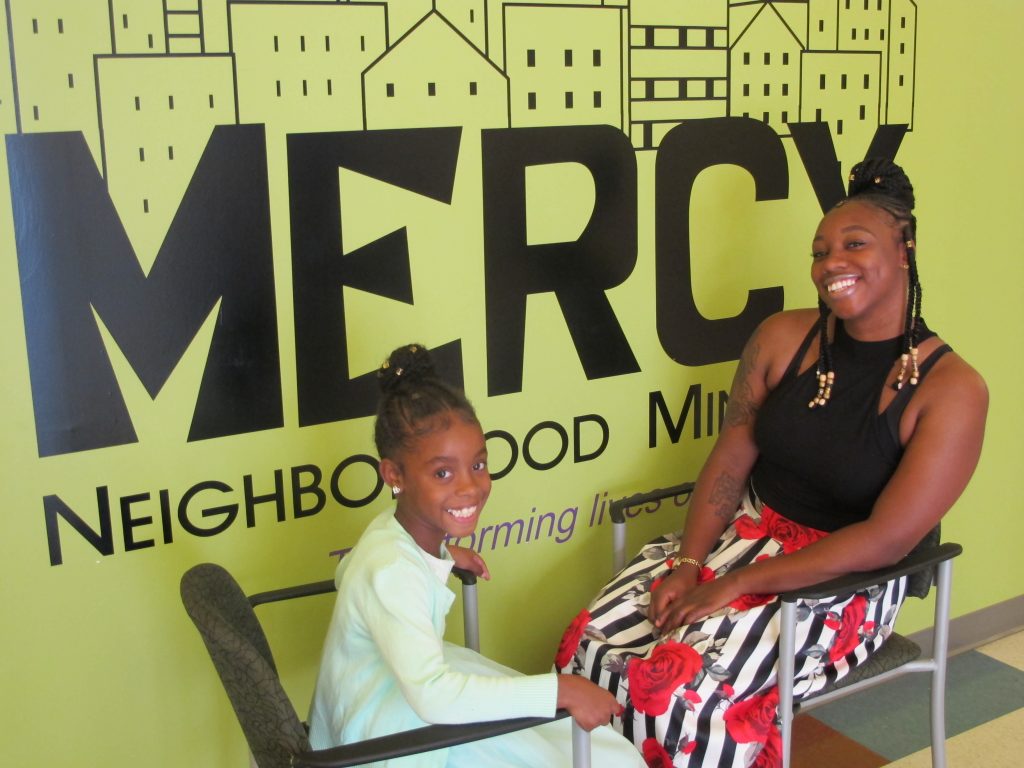 Jafina DeVoe talks with her daughter Skie’lor about her day at preschool at Mercy Neighborhood Ministries.