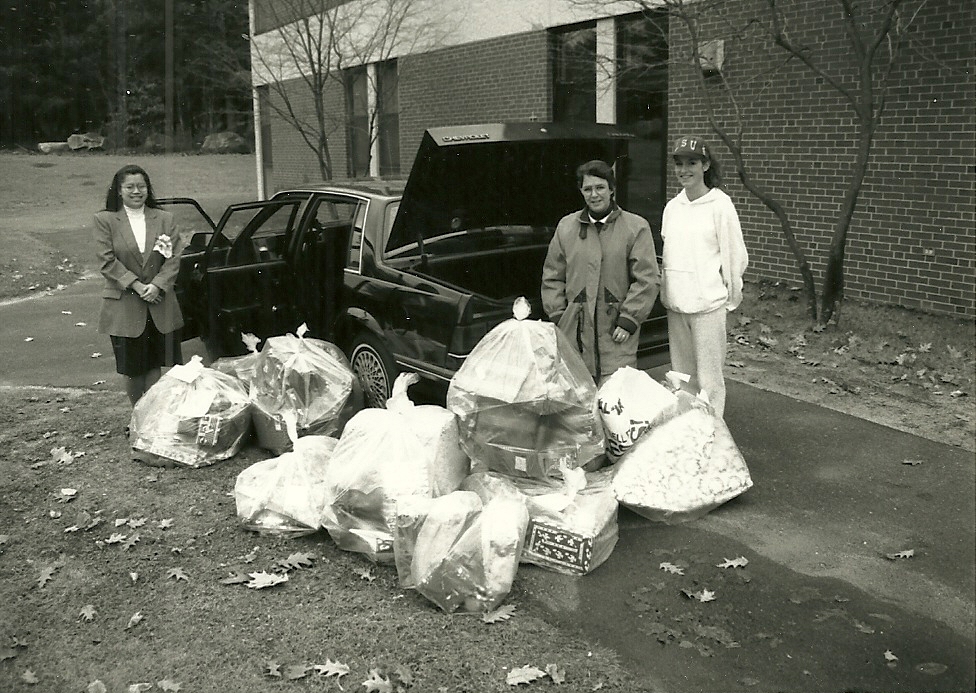 Sister Sylvia (center) oversees a Toys for Tots campus ministry project in December 1993. Credit: Saint Joseph’s College.