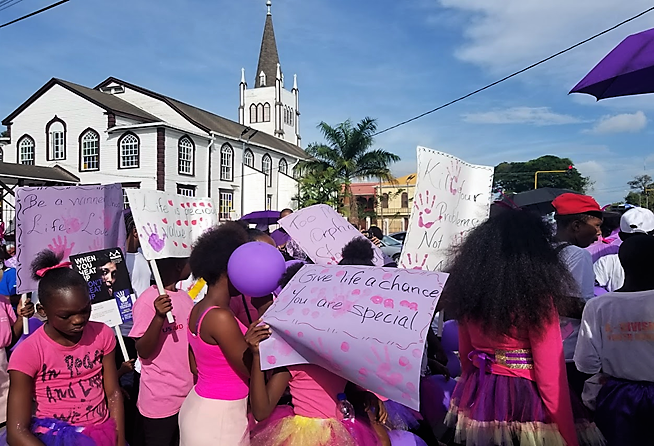 People in Georgetown, Guyana marching against violence against women