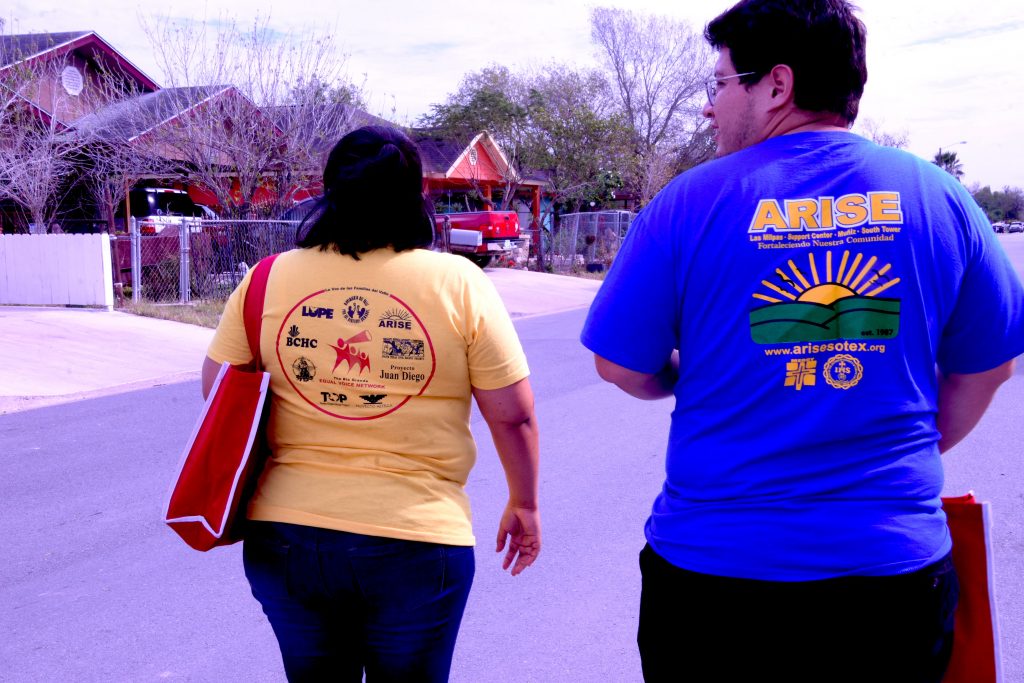 This is an important picture.  It shows two volunteers from the ARISE ministry walking from door to door to ensure that people are registered to vote.  It is essential that all of us engage our voice by voting.