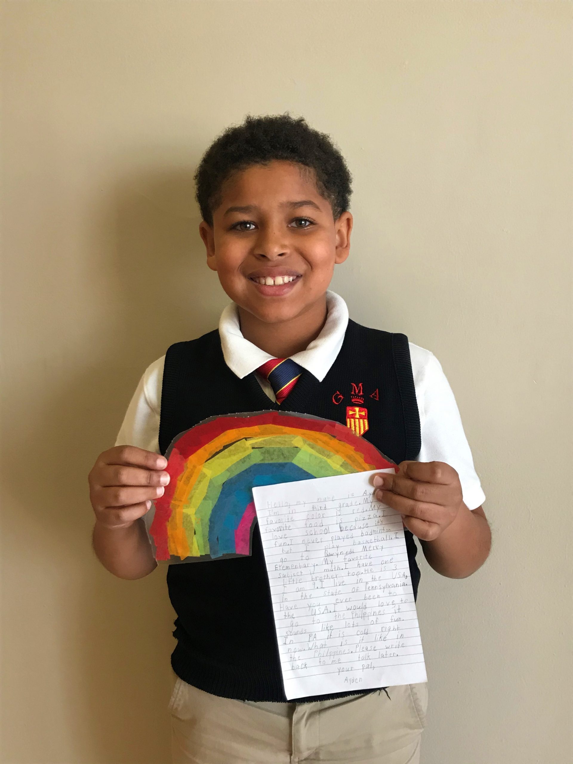 Another Gwynedd-Mercy student prepares a letter to his pen pal in the Philippines.