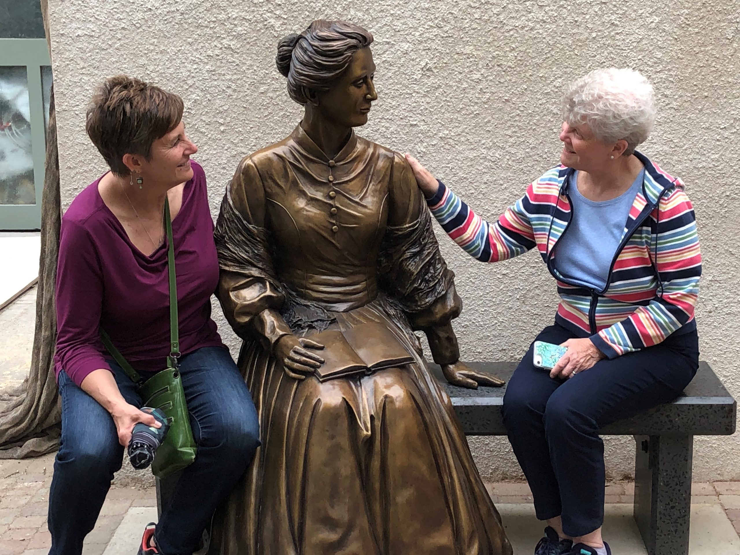Sister Judy sits with Mary Serowoky, FNP, a colleague in the McAuley School of Nursing at the University of Detroit Mercy. They are beside the new statue of Catherine McAuley in the garden behind the Mercy International Centre in Dublin, Ireland (2019). Last summer, they were among 14 Detroit Mercy nursing students, alumni and faculty who visited Ireland and sites that inspired Catherine to found the Sisters of Mercy in 1831. A return trip with Detroit Mercy, planned for June 2020, was canceled because of COVID-19.