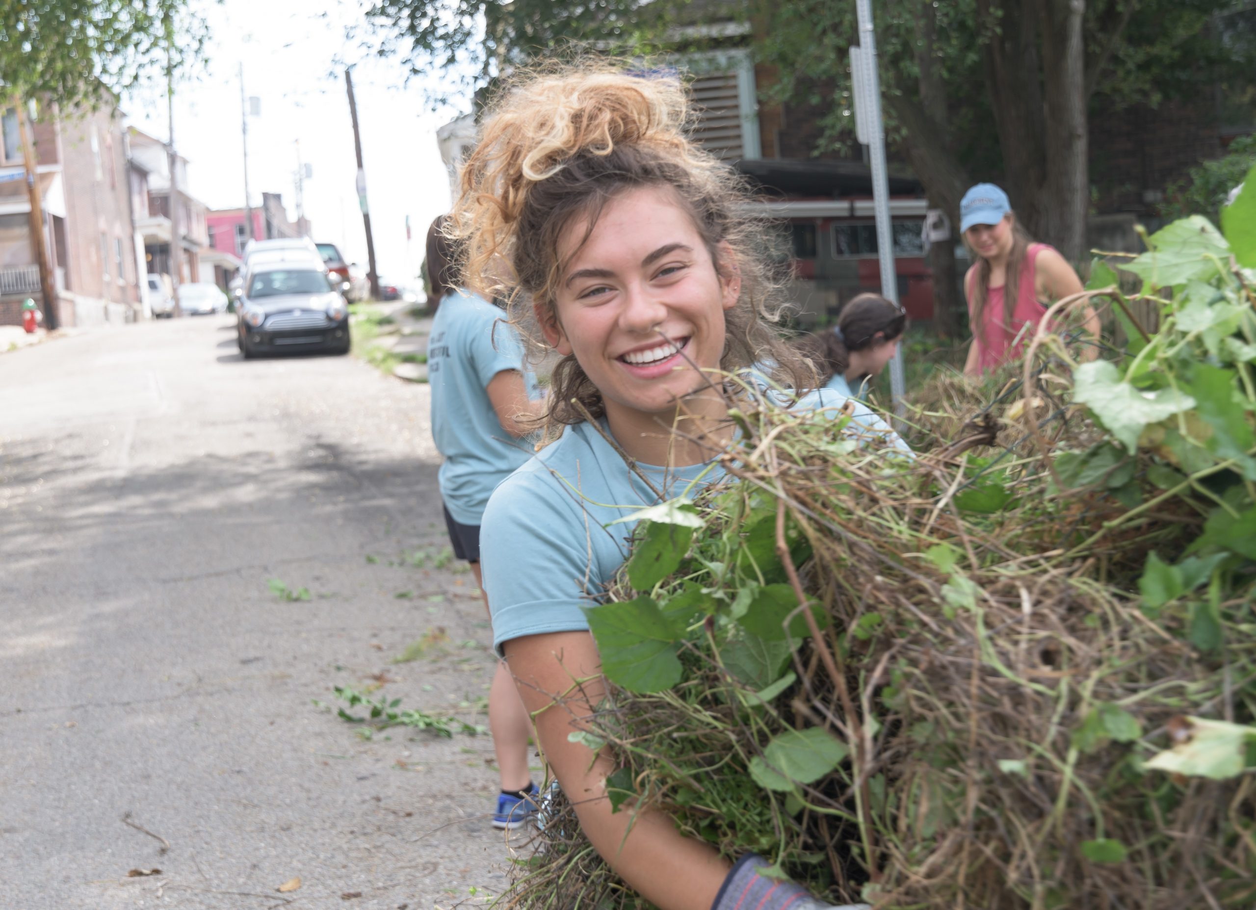 A University of Detroit Mercy student helps clean up in a local neighborhood. Just one of the many ways you can #MakeMercyReal!