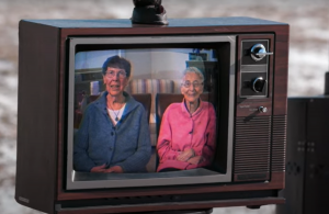 Sisters Pat and JoAnn pictured on an old television.